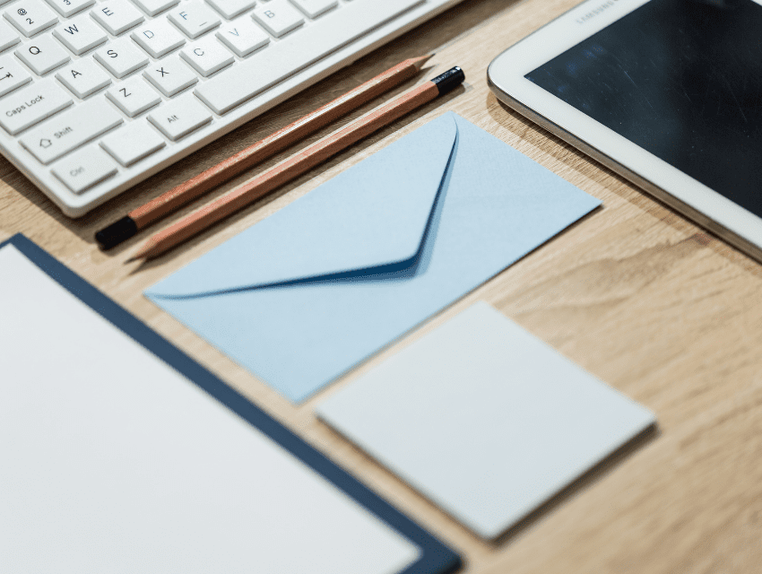 Pamela-Sandall-Design_Los-Angeles-California_How-to-Inspire-Feelings-of-Joy-at-Home_Neatly-Organized-Desk-Surface-with-Keyboard-and-Light-Blue-Envelope